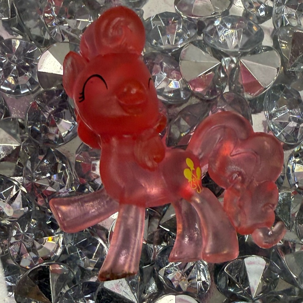My Little Pony translucent pink figure with yellow flower cutie mark